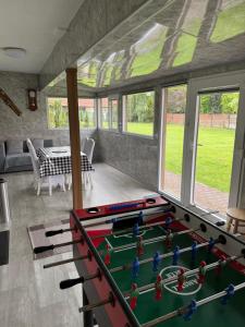 a room with a pool table in a house at Liptovský Ján,Apartmán N5,Apartmán N13 in Liptovský Ján