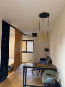 a living room with a table and a couch at Studio apartment in Slezská Ostrava