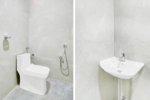 a white bathroom with a toilet and a sink at Super Townhouse Badangpet Crossway Hyderabad Formerly Balapur in Surūrnagar +26 photos