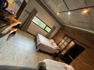 an overhead view of a room with a couch and a window at Arenas Lodge Hotel in Esquina +75 photos