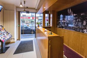 a room with a bar with a view of a street at Modern Hotel in Paris