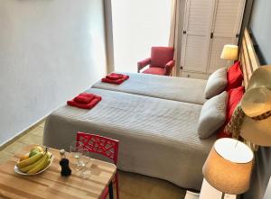 a room with a bed and a table with bananas on it at Eleana Apartments in Hersonissos