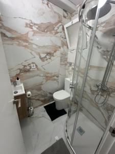 a bathroom with a shower and a toilet at TAJ ROOM center altea #D in Altea