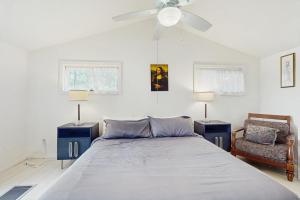 a bedroom with a bed and a ceiling fan at Bomo Hacienda in Castleton