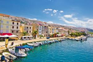 a group of boats are docked in a river at 4Rest Villa in Novalja