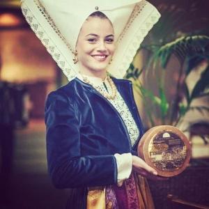 a woman in a costume holding a clock at 4Rest Villa in Novalja +106 photos