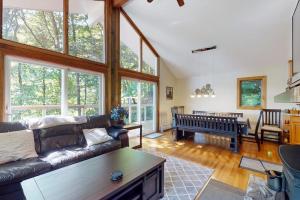 a living room with a couch and a table at Killington's Hideaway in Killington