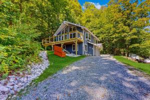 a large house with a deck on the side of it at Killington's Hideaway in Killington