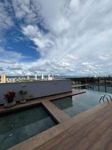 a swimming pool on the roof of a building at AliReserva Luxury Suites in Palmas