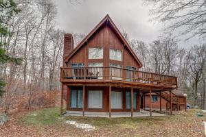 a large house with a deck on top of it at South Hill Lodge in Ludlow