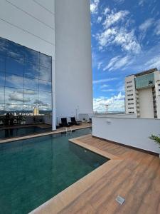 a swimming pool on the roof of a building at AliReserva Luxury Suites in Palmas