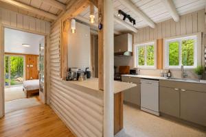 a kitchen with a counter and a sink in a room at Sauna Forest Escape & Relaxation - Chalet Orman in Brownsburg