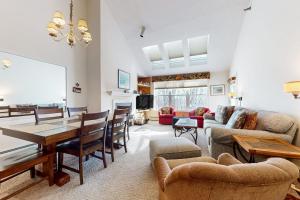 a large living room with a table and chairs at Winterplace Getaway in Ludlow