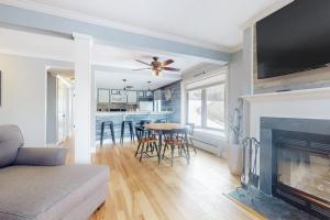 a living room with a couch and a fireplace at Ascutney Retreat in Brownsville