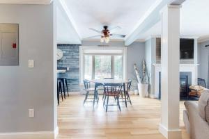 a living room with a table and chairs and a ceiling at Ascutney Retreat in Brownsville