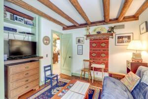 a living room with a couch and a tv at Mount Holly Home in Mount Holly