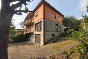 a large house with a garage in front of it at Villa Bice in Maresana in Ponteranica