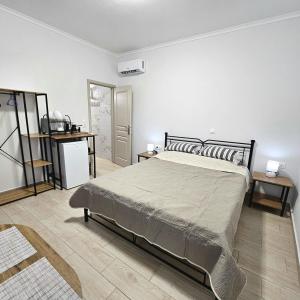 a bedroom with a large bed in a room at Garden Room with Private Patio Salamis in Eantio