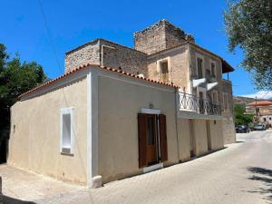 a small house on the side of a street at Sunny Kotronas Tower in Kotronas