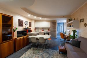 a kitchen and living room with a table and chairs at AuraVista in Montefiascone