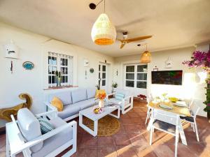 a living room with a couch and a table at VILLA AMIRA ,Marbella Estepona in Benahavís