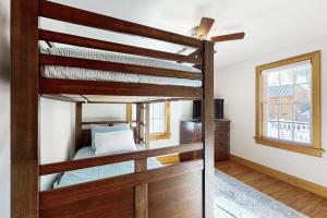 a bedroom with two bunk beds in a house at Strollski Cottage in Ludlow