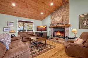 a living room with couches and a fireplace at Meadow View in Banner Elk