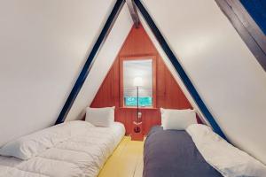 a room with two beds in a tent at The Koliba in Windham