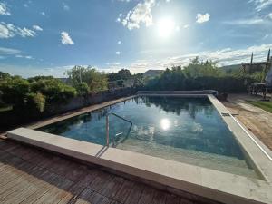 a swimming pool on top of a house at La cabane des jours heureux in Saint-Laurent-de-Carnols