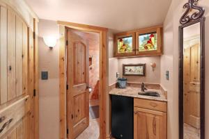 a kitchen with a sink and a stove at Telemark Lodge #504 in Copper Mountain