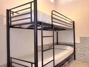 a couple of bunk beds in a room at La Casa di Anastasya in Castiglione Torinese
