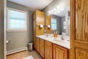 a bathroom with a sink and a mirror at Kindred Hollow in Ludlow +42 photos