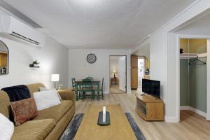 a living room with a couch and a table at Lower A-Frame Escape in Ludlow