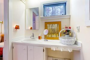 a bathroom with a sink and a mirror at Timberbrook in Dorset +44 photos