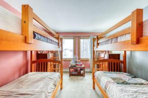 two bunk beds in a room with pink walls at Sunrise - East Glade-C7 in Killington +71 photos