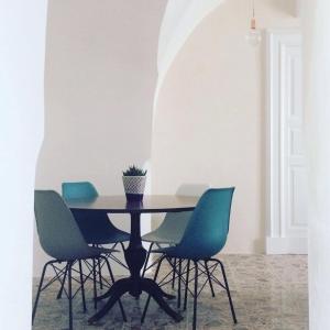 a dining room with a table and chairs at Tolomeo's House-Bed & Bike in Nardò +17 photos