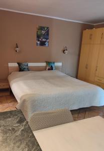 a bedroom with two beds and two lamps at Katica Vendégház in Siófok +224 photos