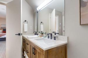 a bathroom with a sink and a large mirror at Styles Brook Retreat in Stratton +46 photos