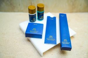 three blue ribbons sitting on top of a table at Milson Hotel in Naran