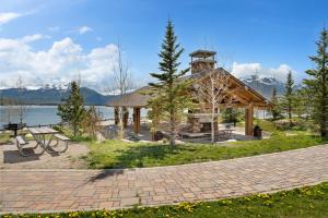 a pavilion with a lake and mountains in the background at Summit Blue #30 : 2 in Silverthorne