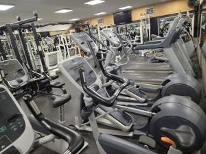 a gym filled with lots of cardio machines at Chez Alex in Verviers +4 photos