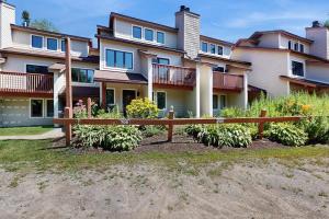 a large house with a fence in front of it at Snow Mountain Village 36D in Dover
