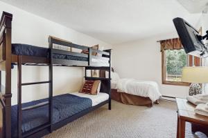 a bedroom with two bunk beds and a desk at Snow Mountain Village 36D in Dover +43 photos