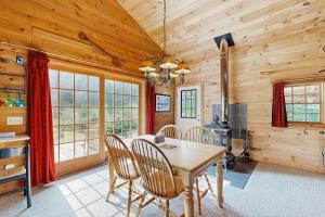 a dining room with a table and chairs at Wandering Trails Retreat in Cambridge