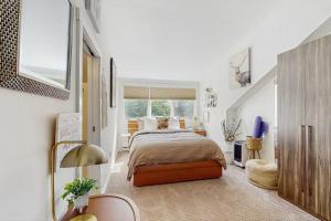 a bedroom with a bed and a large window at Slopeside A2 in Stratton +39 photos