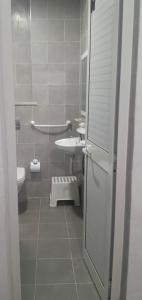 a small bathroom with a sink and a toilet at one hostel in Tabarka