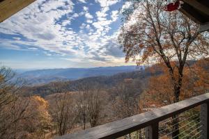 a view of the mountains from the porch of a cabin at Out On A Limb in Blowing Rock