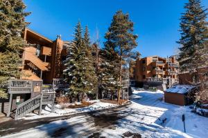 an apartment complex in the winter with snow on the ground at Key Condo #2929 in Keystone