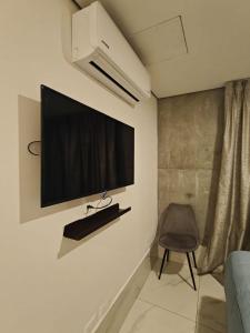 a flat screen tv on a wall in a room at Purísima 5 0 in Monterrey