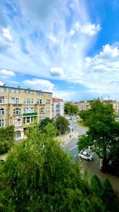 a view of a street in a city with buildings at Beautiful Rooms - Park Kasprowicza in Szczecin
